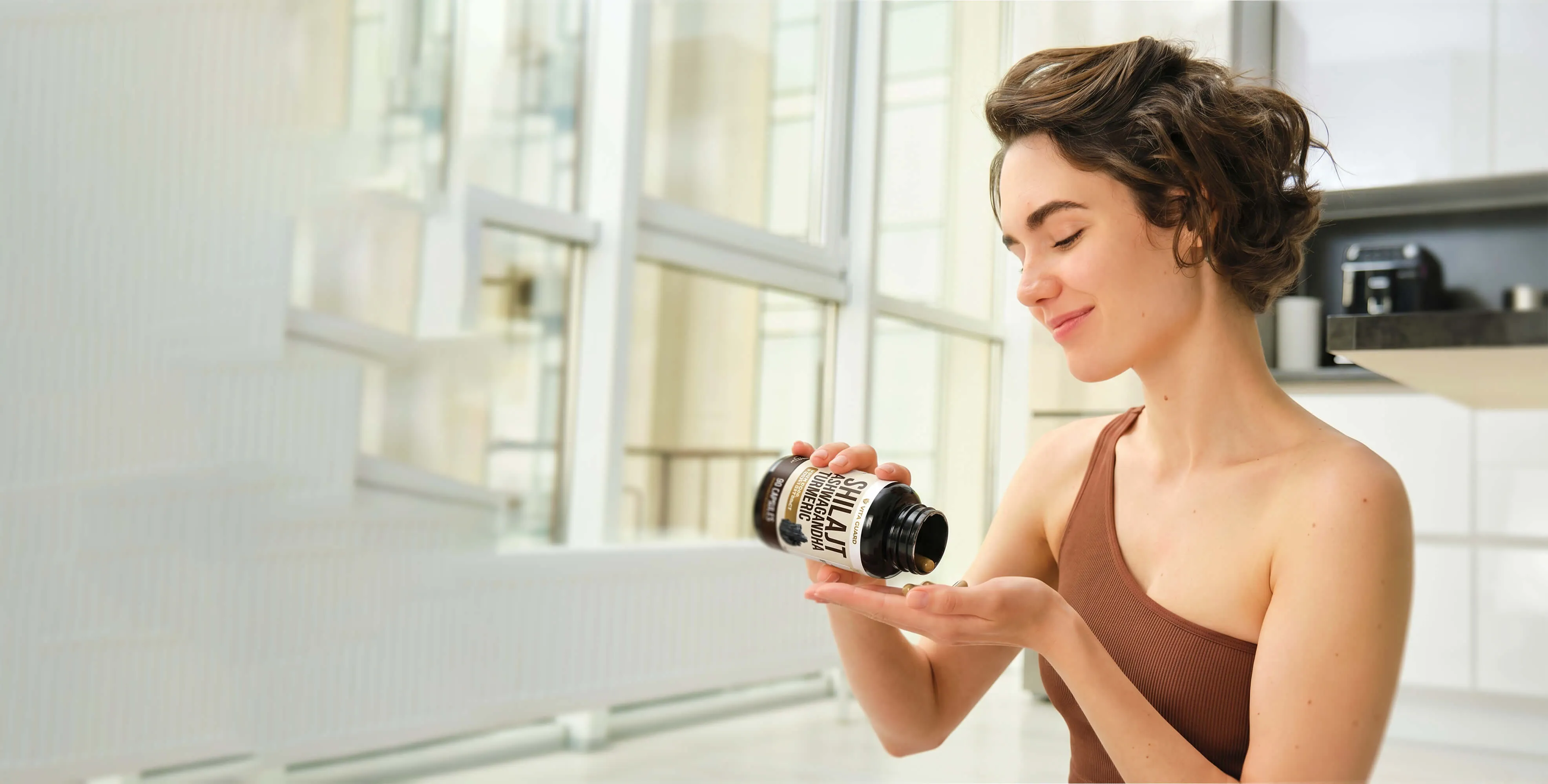 Young woman drinking a Vita Guard supplement